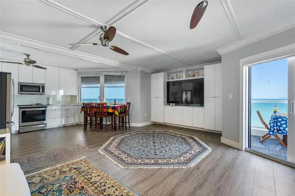 a view of a hallway with painting on the wall