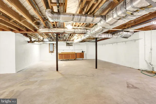 a view of an entryway with wooden floor and door