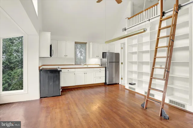 a front view of a house with a yard table and chairs