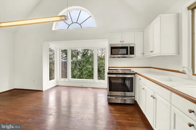 a front view of a house with a yard table and chairs