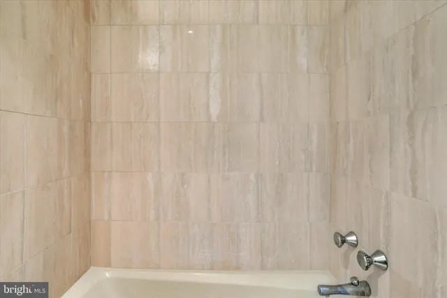 a view of dirt yard with a large tree