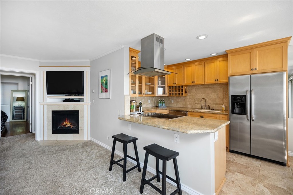 21702 Ocean Vista Drive, Unit B Laguna Beach, CA 92651 - Photo 21 of 47 Remodeled kitchen with custom cabinets, stainless steel appliances, and luxurious counter tops and backsplash.