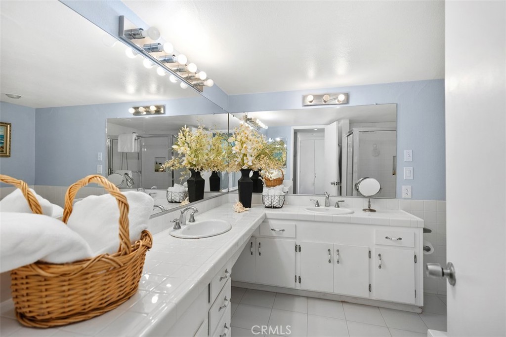 21702 Ocean Vista Drive, Unit B Laguna Beach, CA 92651 - Photo 28 of 47 Dual vanity in the bathroom, with lots of lighting.