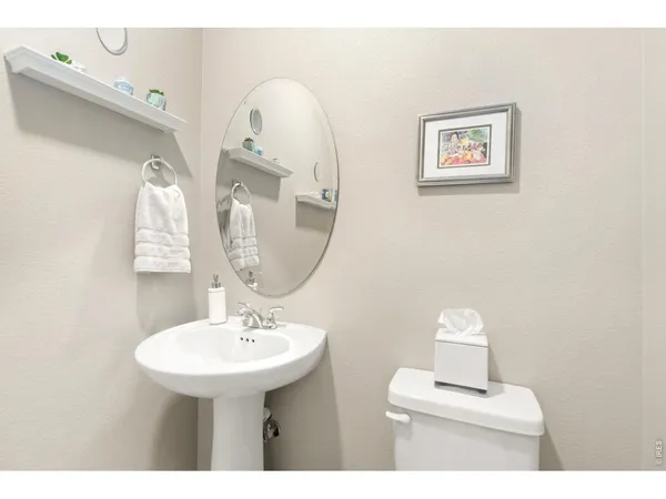 a bathroom with 2 sink and a mirror
