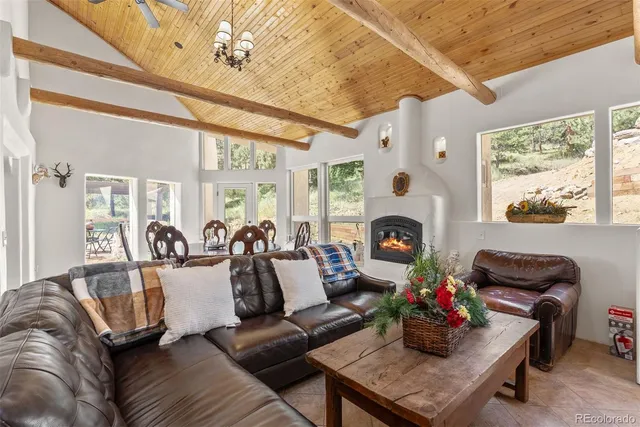 a dining room with furniture a rug and wooden floor