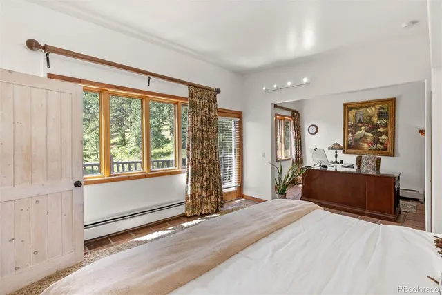 a spacious bathroom with a granite countertop sink mirror and bathtub