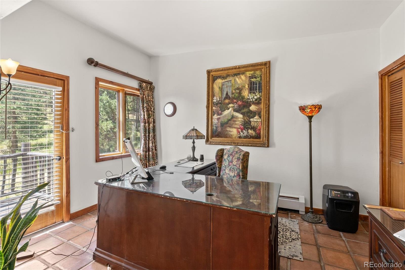 1053 Red Moon Road Evergreen, CO 80439 - Photo 37 of 50 a dining room with furniture and large windows