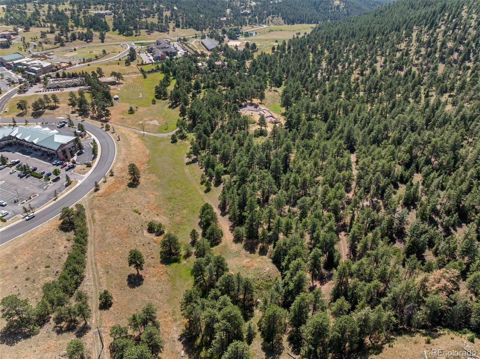 1053 Red Moon Road Evergreen, CO 80439 - Photo 9 of 50 an aerial view of a house with a yard