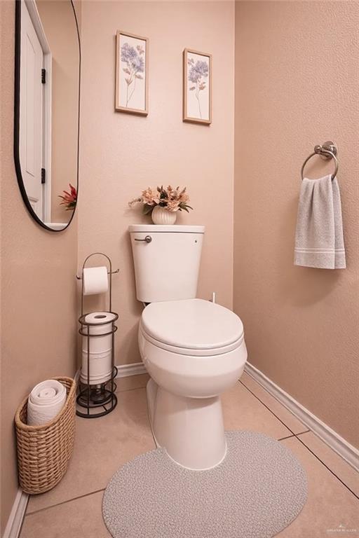 906 East Solar Drive Mission, TX 78574 - Photo 15 of 18 a white toilet sitting next to a bathroom sink