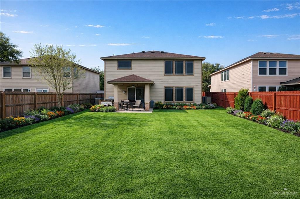 906 East Solar Drive Mission, TX 78574 - Photo 3 of 18 a front view of a house with a yard table and chairs