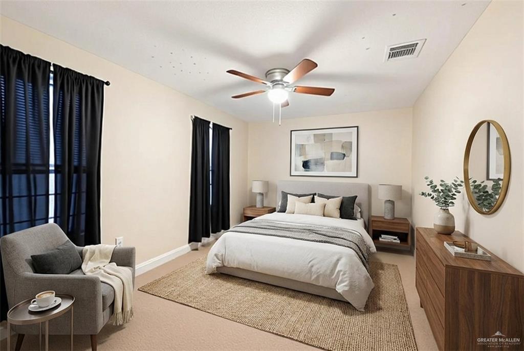 906 East Solar Drive Mission, TX 78574 - Photo 9 of 18 a bedroom with a bed couch and a window