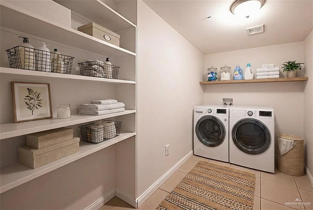 906 East Solar Drive Mission, TX 78574 - Photo 10 of 18 a view of a kitchen with fridge and wooden floor