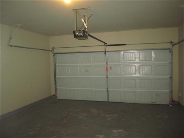 9451 Elliotts Court Conroe, TX 77304 - Photo 18 of 18 ROOMY 2 CAR GARAGE