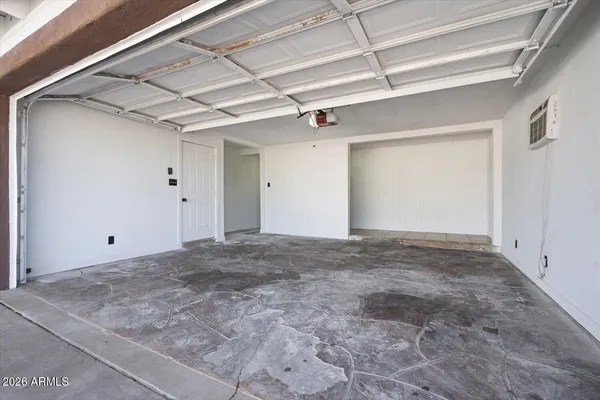 a view of a hallway with a ceiling fan