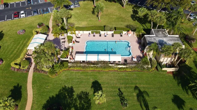 a view of a swimming pool with a yard