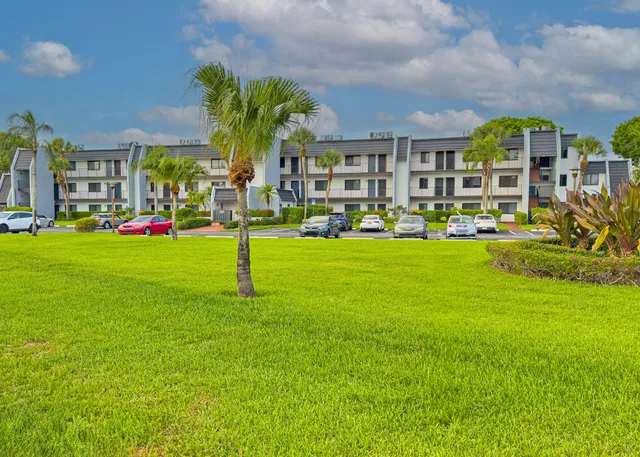 a view of a building with a yard
