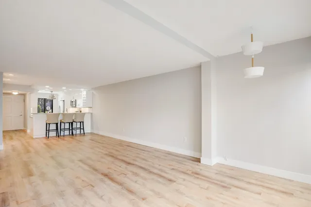 a view of a livingroom with a kitchen