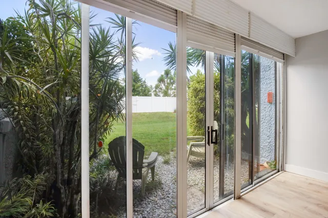 a view of a glass door and porch