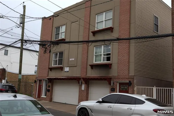 a view of a car park in front of house