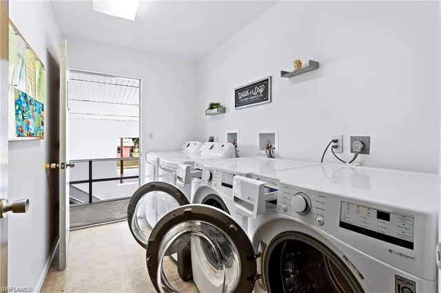a view of livingroom with washer and dryer
