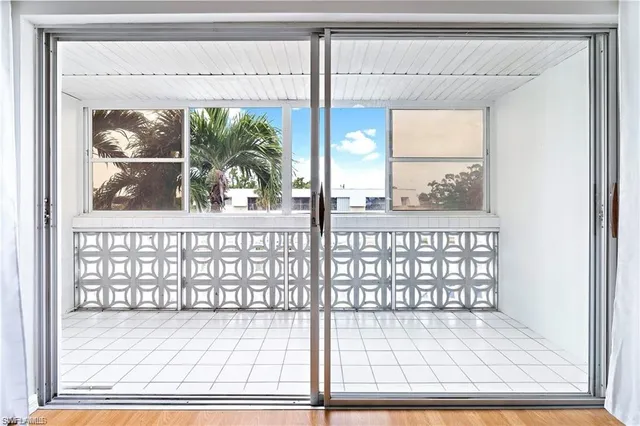 a view of a glass door and a window