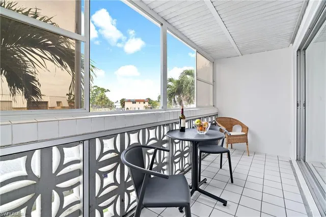 a view of a balcony with furniture