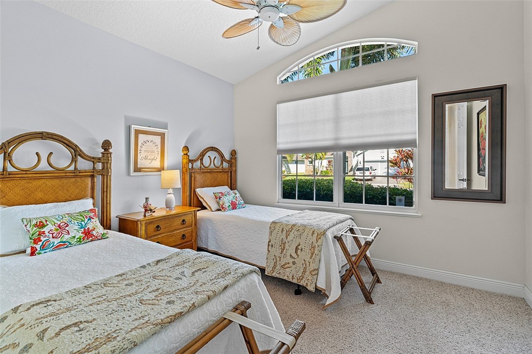 567 Gossamer Wing Way Sebastian, FL 32958 - Photo 13 of 35 a bed room with a bed and a chair