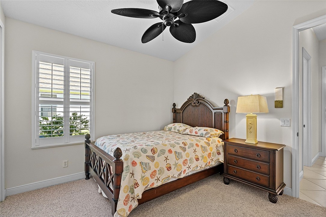 567 Gossamer Wing Way Sebastian, FL 32958 - Photo 15 of 35 a bedroom with a bed and window