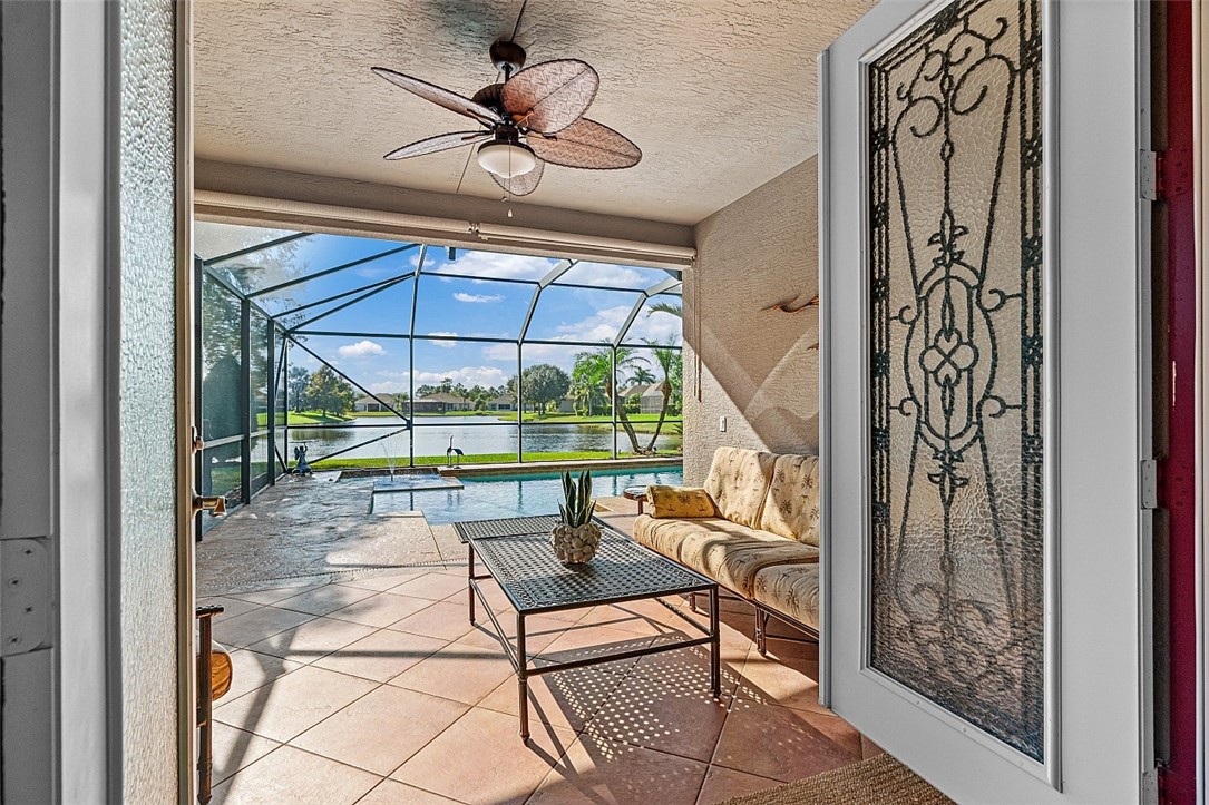 567 Gossamer Wing Way Sebastian, FL 32958 - Photo 17 of 35 a chair and table in a hall with wooden floor