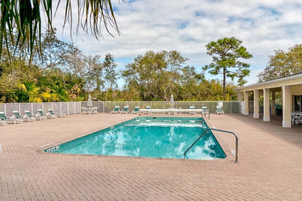 567 Gossamer Wing Way Sebastian, FL 32958 - Photo 23 of 35 a view of a swimming pool with a yard