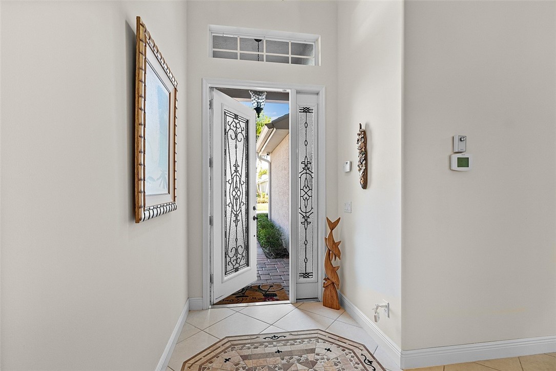 567 Gossamer Wing Way Sebastian, FL 32958 - Photo 3 of 35 a view of a hallway with wooden floor and a livingroom