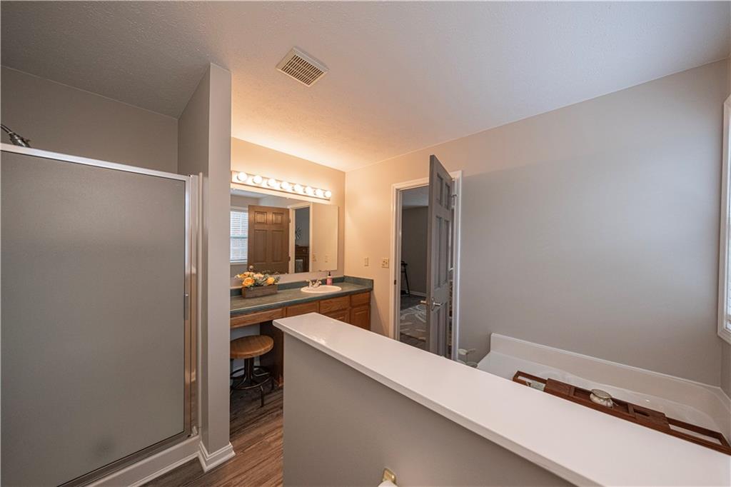 435 Cottage Lane Monroeville, PA 15146 - Photo 26 of 46 Private en-suite bath features a relaxing soaking tub, separate shower, and ample space for everyday comfort.