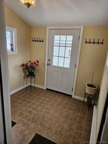 a view of a room with furniture and wooden floor