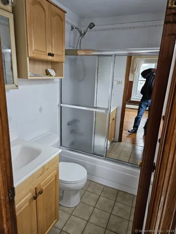 a bathroom with a shower and toilet