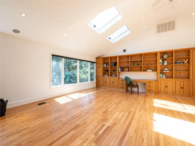 a living room filled with furniture and a table