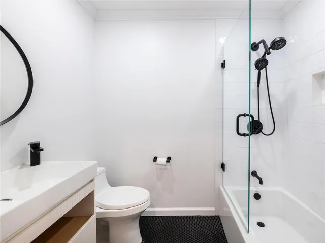 a bathroom with a sink a toilet and a tub