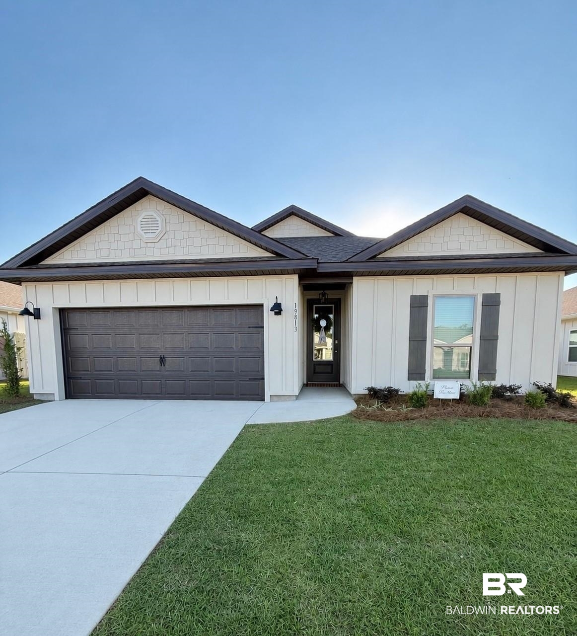 19813 Powercourt Road Silverhill, AL 36576 - Photo 1 of 36 Contemporary home exterior featuring vertical panel siding and a dark roof
