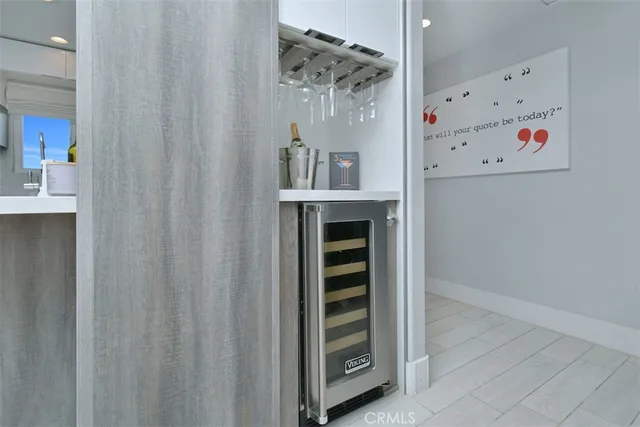a kitchen with stainless steel appliances a sink and a refrigerator
