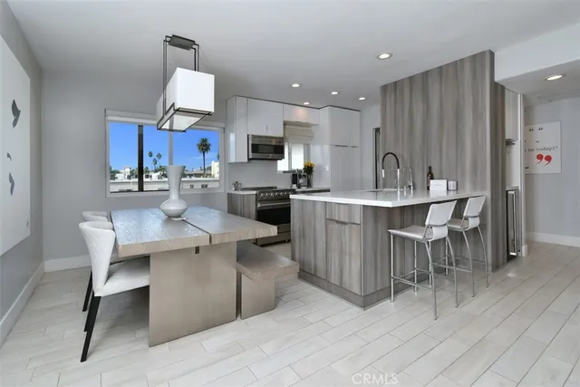 a kitchen with a sink cabinets and microwave