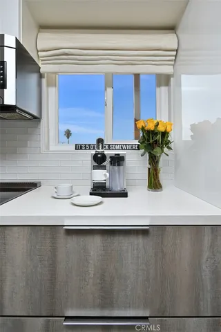a kitchen with a sink and a stove top oven