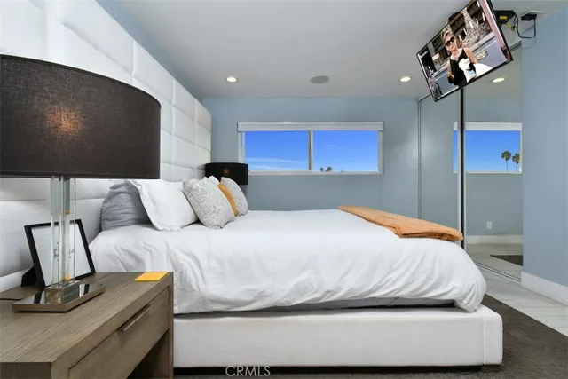 a view of a living room hardwood floor and a large window
