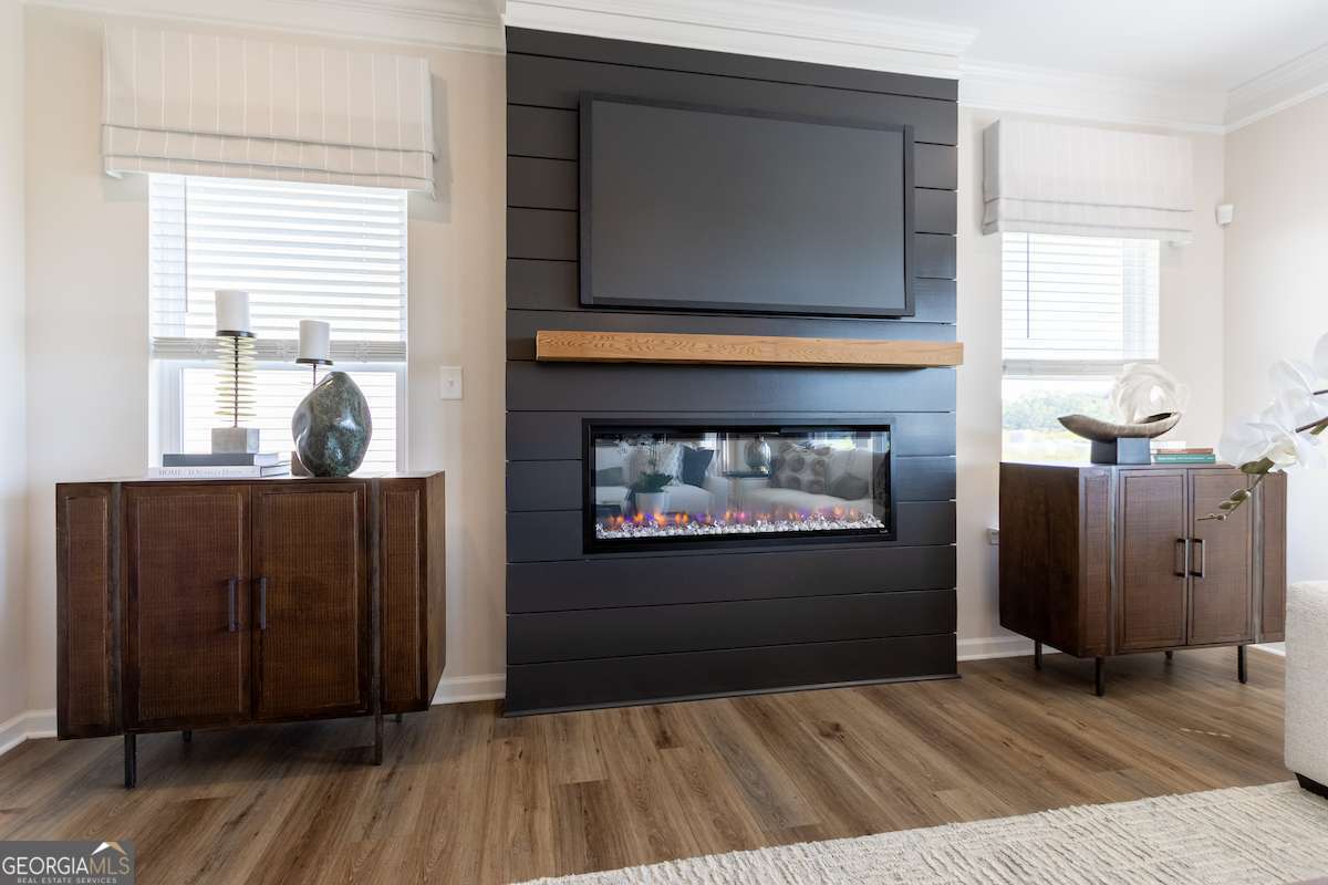 242 Shantz Way Byron, GA 31008 - Photo 15 of 34 a view of a livingroom with wooden floor and a fireplace