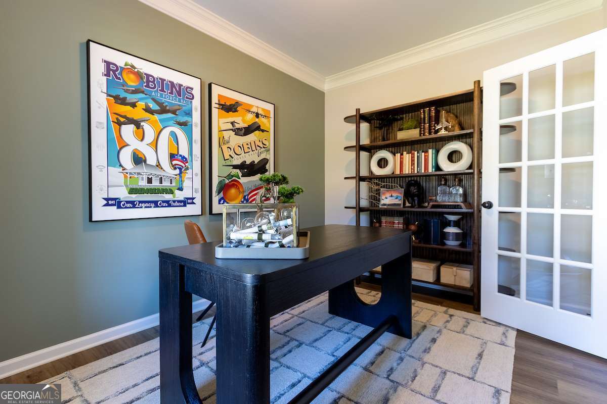 242 Shantz Way Byron, GA 31008 - Photo 19 of 34 a room with furniture and a book shelf