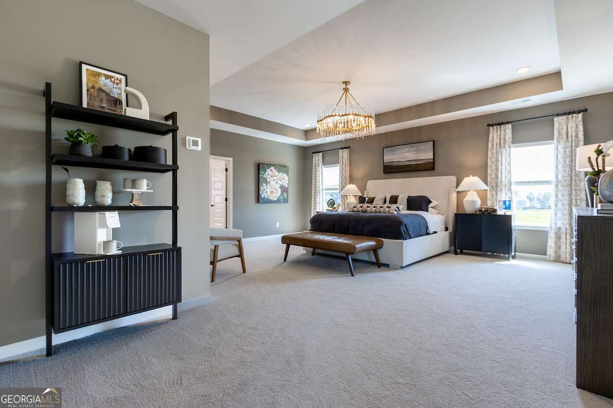 242 Shantz Way Byron, GA 31008 - Photo 21 of 34 a living room with furniture and a chandelier