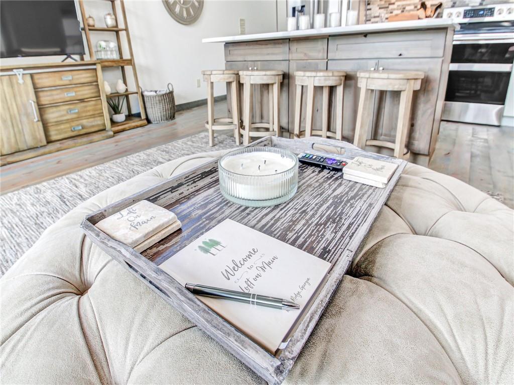 685 East Main Street, Unit B Blue Ridge, GA 30513 - Photo 17 of 57 a living room with furniture and a table