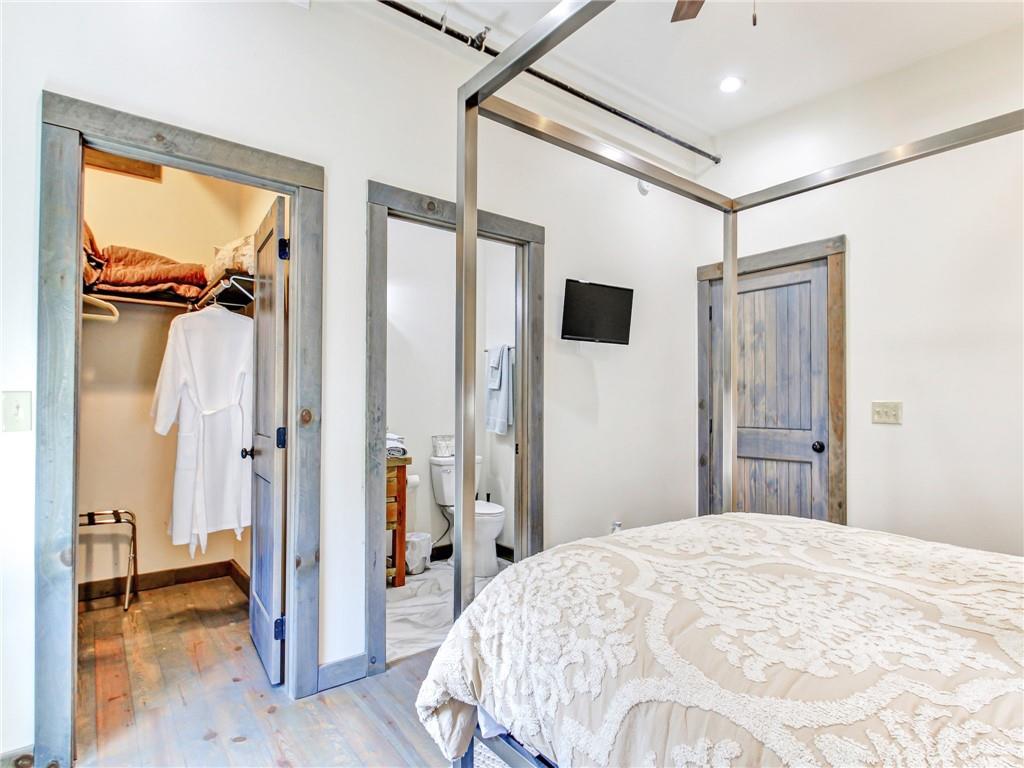 685 East Main Street, Unit B Blue Ridge, GA 30513 - Photo 22 of 57 a bedroom with a bed and a mirror