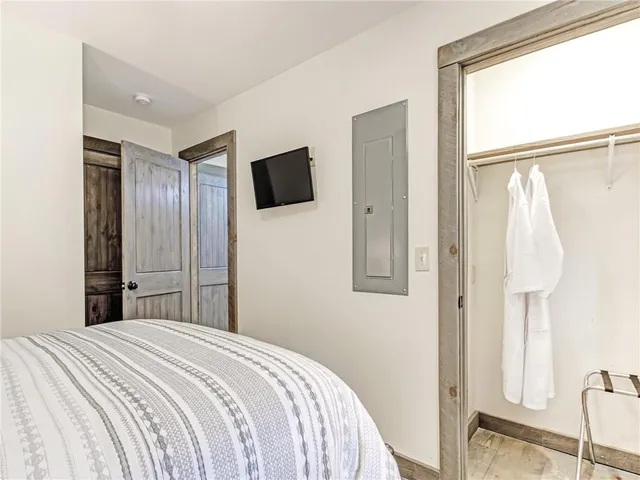 a view of a storage and utility room with washer and dryer