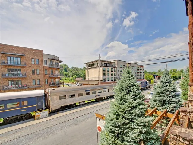 a view of lobby with hardwood floor and living room
