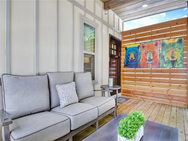 a view of city from balcony with seating space