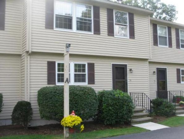 20 1/2 Webb Street, Unit 2A Middleton, MA 01949 - Photo 1 of 17 a view of a house with a yard and a garden